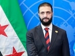 Syrian President Ahmed al-Sharaa visits with UN Secretary-General Antonio Guterres (off frame) during the United Nations General Assembly at the UN headquarters in New York City on September 24, 2025.