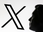A 3D-printed miniature model of Elon Musk and the X logo are seen in this illustration taken January 23, 2025.