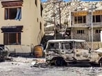 Charred remains of vehicles outside the BJP headquarters building, in the aftermath of violent clashes between demonstrators and police during a protest demanding statehood for Ladakh, in Leh, Thursday, Sept. 25, 2025.