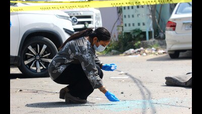 A forensic team taking samples from the crime scene outside the victim’s gym in Phase 2, Mohali. (Ravi Kumar/HT) A forensic team taking samples from the crime scene outside the victim’s gym in Phase 2, Mohali. (Ravi Kumar/HT)