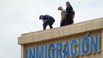 Law enforcement agents look around the roof of a building near the scene of a shooting at a U.S. Immigration and Customs Enforcement office in Dallas on Wednesday, Sept. 24, 2025. (AP) Law enforcement agents look around the roof of a building near the scene of a shooting at a U.S. Immigration and Customs Enforcement office in Dallas on Wednesday, Sept. 24, 2025. (AP)