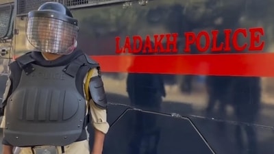 A police official stands guard a day after violence erupted over statehood and other demands, in Leh A police official stands guard a day after violence erupted over statehood and other demands, in Leh