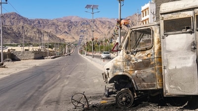 Charred remains of a vehicle lie in the aftermath of violent clashes between demonstrators and police during a protest demanding statehood for Ladakh, outside the BJP headquarters building, in Leh, Thursday, Sept. 25, 2025. (PTI) Charred remains of a vehicle lie in the aftermath of violent clashes between demonstrators and police during a protest demanding statehood for Ladakh, outside the BJP headquarters building, in Leh, Thursday, Sept. 25, 2025. (PTI)