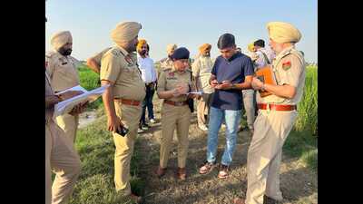 Police at the encounter site in Dasuwal village of Tarn Taran on Thursday. (HT Photo)