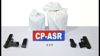 The weapons and heroin seized by police in Amritsar. (HT) The weapons and heroin seized by police in Amritsar. (HT)
