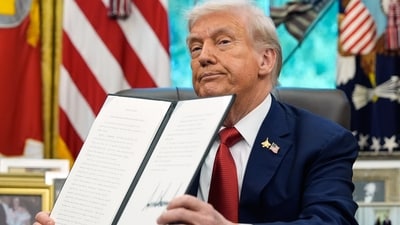 President Donald Trump holds a signed executive order regarding TikTok in the Oval Office at the White House (AP) President Donald Trump holds a signed executive order regarding TikTok in the Oval Office at the White House (AP)
