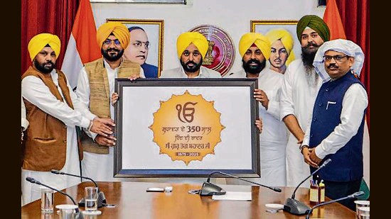 Punjab chief minister Bhagwant Mann releases a logo for state-level commemorative events to mark the 350th martyrdom day of Guru Teg Bahadur in Chandigarh on Thursday. (PTI)
