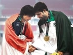 India’s Neeraj Chopra with Pakistan’s Arshad Nadeem at the victory ceremony for the men’s javelin throw at the 2018 Asian Games in Jakarta. (AFP)