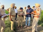 Police at the encounter site in Dasuwal village of Tarn Taran on Thursday. (HT Photo) Police at the encounter site in Dasuwal village of Tarn Taran on Thursday. (HT Photo)