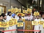 Punjab Aam Aadmi Party MLAs protesting against Prime Minister Narendra Modi for not paying heed to the state government’s demand for a <span class='webrupee'>₹</span>20,000-crore flood relief package during the special session of the assembly in Chandigarh on Friday. (Ravi Kumar/HT) Punjab Aam Aadmi Party MLAs protesting against Prime Minister Narendra Modi for not paying heed to the state government’s demand for a <span class='webrupee'>₹</span>20,000-crore flood relief package during the special session of the assembly in Chandigarh on Friday. (Ravi Kumar/HT)