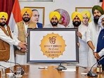 Punjab chief minister Bhagwant Mann releases a logo for state-level commemorative events to mark the 350th martyrdom day of Guru Teg Bahadur in Chandigarh on Thursday. (PTI)