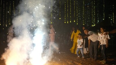 People light fire crackers during Diwali, the festival of lights (AP file) People light fire crackers during Diwali, the festival of lights (AP file)