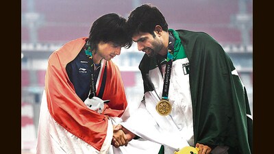 India’s Neeraj Chopra with Pakistan’s Arshad Nadeem at the victory ceremony for the men’s javelin throw at the 2018 Asian Games in Jakarta. (AFP) India’s Neeraj Chopra with Pakistan’s Arshad Nadeem at the victory ceremony for the men’s javelin throw at the 2018 Asian Games in Jakarta. (AFP)