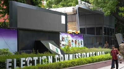 New Delhi: People walk past the Election Commission, in New Delhi, Thursday, Sept. 11, 2025. (PTI Photo/Karma Bhutia) (PTI)
