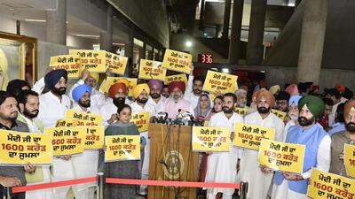 Punjab Aam Aadmi Party MLAs protesting against Prime Minister Narendra Modi for not paying heed to the state government’s demand for a ₹20,000-crore flood relief package during the special session of the assembly in Chandigarh on Friday. (Ravi Kumar/HT) Punjab Aam Aadmi Party MLAs protesting against Prime Minister Narendra Modi for not paying heed to the state government’s demand for a ₹20,000-crore flood relief package during the special session of the assembly in Chandigarh on Friday. (Ravi Kumar/HT)
