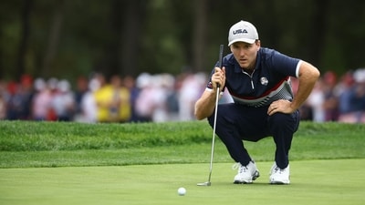 Russell Henley of Team United States lines up a putt on the ninth green during the Friday morning foursomes matches of the 2025 Ryder Cup. (Getty Images via AFP) Russell Henley of Team United States lines up a putt on the ninth green during the Friday morning foursomes matches of the 2025 Ryder Cup. (Getty Images via AFP)