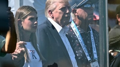 US President Donald Trump and his granddaughter Kai Trump attend the Ryder Cup golf tournament at Bethpage Black Golf Course in Farmingdale. (AP)