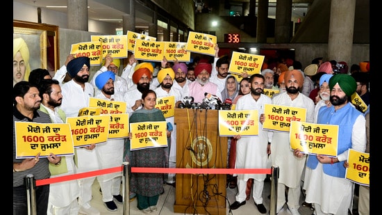 Ruling Aam Aadmi Party’s MLAs and ministers after staging a walkout on the first day of the Punjab Vidhan Sabha session on Friday. (Ravi Kumar/HT)