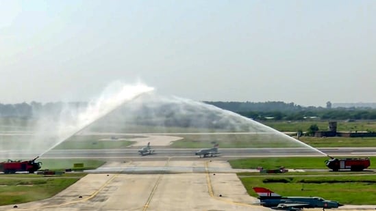 Indian Air Force MiG-21 aircraft receive water salute ahead of the operational flying culmination ceremony at the air force station in Chandigarh.(@IAF_MCC/X)