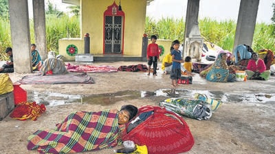 Dharashiv, India. Sep 27, 2025 - Villagers of Jadgaon village take shelter in the temple after heavy rain and floods in Dharashiv district. Over the past four days, eight people have lost their lives, and more than 150 villages have been affected by the intense rainfall. Dharashiv, India. Sep 27, 2025. (Photo by Raju Shinde/HT Photo) (Raju Shinde) Dharashiv, India. Sep 27, 2025 - Villagers of Jadgaon village take shelter in the temple after heavy rain and floods in Dharashiv district. Over the past four days, eight people have lost their lives, and more than 150 villages have been affected by the intense rainfall. Dharashiv, India. Sep 27, 2025. (Photo by Raju Shinde/HT Photo) (Raju Shinde)