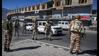 Indo-Tibetan Border Police (ITBP) personnel inspect vehicles during a curfew in Leh on Saturday. (AFP)