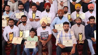 Progressive farmers after being felicitated at the PAU in Ludhiana on Saturday. Progressive farmers after being felicitated at the PAU in Ludhiana on Saturday.