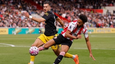 Manchester United's Diogo Dalot in action against Brentford's Kevin Schade. (Action Images via Reuters)