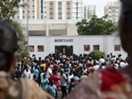 Relatives gather in front of the mortuary of Karur Government Medical College to receive bodies of victims following a stampede incident at an election campaign rally held by Tamilaga Vettri Kazhagam, in Karur district of Tamil Nadu