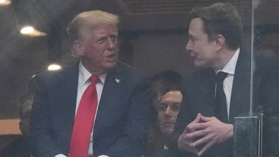 President Donald Trump and Elon Musk talk during a memorial for Charlie Kirk, on  Sunday, September 21, 2025, in Glendale, Arizona. (AP File)