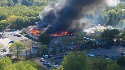 In this image taken from video released by Julie J, @Malkowski6April, Massive flames and smoke rise from The Church of Jesus Christ of Latter-day Saints in Grand Blanc, about 50 miles north of Detroit, Sunday, Sept. 28, 2025. (Julie J, @Malkowski6April via AP) (AP) In this image taken from video released by Julie J, @Malkowski6April, Massive flames and smoke rise from The Church of Jesus Christ of Latter-day Saints in Grand Blanc, about 50 miles north of Detroit, Sunday, Sept. 28, 2025. (Julie J, @Malkowski6April via AP) (AP)
