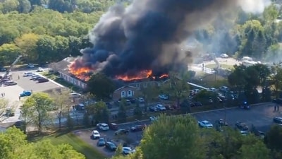Massive flames and smoke rise from The Church of Jesus Christ of Latter-day Saints in Grand Blanc (AP) Massive flames and smoke rise from The Church of Jesus Christ of Latter-day Saints in Grand Blanc (AP)