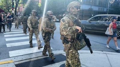Federal agents patrol downtown Chicago, Sunday, Sept. 28, 2025. (AP) Federal agents patrol downtown Chicago, Sunday, Sept. 28, 2025. (AP)