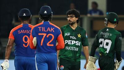 India's Sanju Samson and Tilak Varma during the match, in Dubai on Sunday. (AFP)