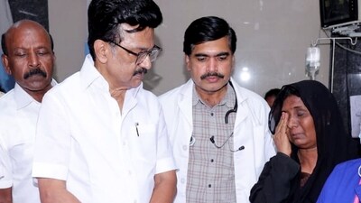 Tamil Nadu Chief Minister MK Stalin talks to a family member of one of the victims of the stampede that occurred in Karur on Saturday evening. (PTI )