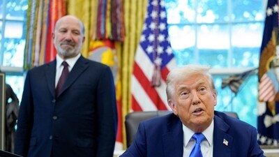 Howard Lutnick, US commerce secretary, stands behind President Donald Trump at the Oval Office in the White House in Washington. (Photo: Aaron Schwartz/CNP/Bloomberg) Howard Lutnick, US commerce secretary, stands behind President Donald Trump at the Oval Office in the White House in Washington. (Photo: Aaron Schwartz/CNP/Bloomberg)