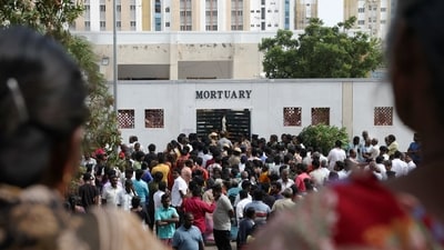 Relatives gather in front of the mortuary of Karur Government Medical College to receive bodies of victims following a stampede incident at an election campaign rally held by Tamilaga Vettri Kazhagam, in Karur district of Tamil Nadu (REUTERS)