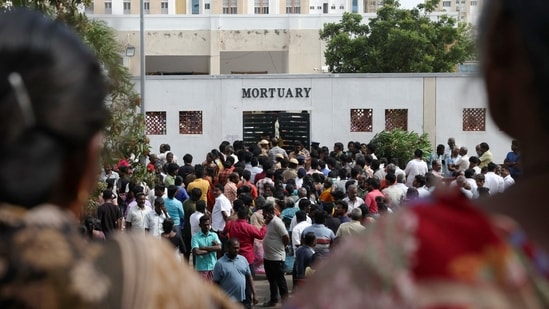 Relatives gather in front of the mortuary of Karur Government Medical College to receive bodies of victims following a stampede incident at a rally in Tamil Nadu(Reuters)