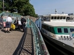 Tour boat "Portland Spirit" sits before setting out for a routine trip in downtown Portland, Oregon, a day after US President Donald Trump said he was directing the US military to deploy to the city.