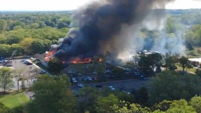 A frame grab from a drone footage shows smoke rising from the Mormon church in the US state of Michigan that was set on fire on Sunday. (AFP) A frame grab from a drone footage shows smoke rising from the Mormon church in the US state of Michigan that was set on fire on Sunday. (AFP)