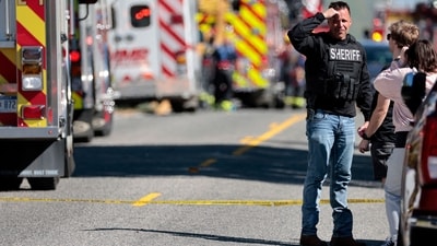 A firefighting official stands at the scene of shooting at the church in Grand Blanc, Michigan after authorities shot dead a suspect who was a 40-year-old man from a nearby town. (Jeff Kowalsky/AFP) A firefighting official stands at the scene of shooting at the church in Grand Blanc, Michigan after authorities shot dead a suspect who was a 40-year-old man from a nearby town. (Jeff Kowalsky/AFP)