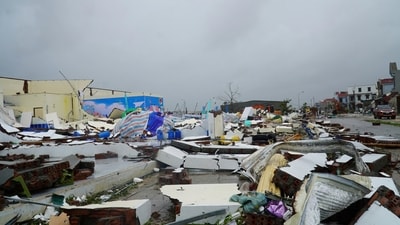 Strong gusts ripped corrugated iron roofs from homes along highways and toppled concrete pillars. (AP) Strong gusts ripped corrugated iron roofs from homes along highways and toppled concrete pillars. (AP)