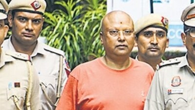Police with the accused Chaitanyananda Saraswati at Vasant Kunj police station in New Delhi. (PTI) Police with the accused Chaitanyananda Saraswati at Vasant Kunj police station in New Delhi. (PTI)