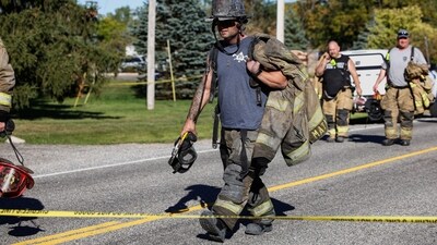 Firegfighters walk away from the scene of a shooting at the Church of Jesus Christ of Latter-day Saints, in Grand Blanc, Michigan. (Rebecca Cook/REUTERS)