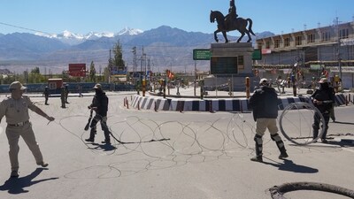 Security personnel block a road with razor wire amid curfew, days after violence during protests for Ladakh statehood, in Leh. (PTI) Security personnel block a road with razor wire amid curfew, days after violence during protests for Ladakh statehood, in Leh. (PTI)