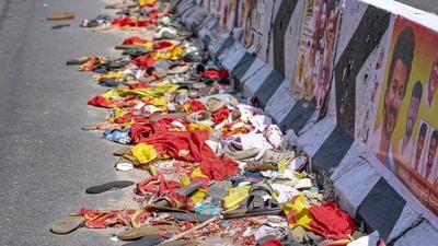 Karur: Footwear and other belongings of people lie on a road in the aftermath of stampede during a rally of actor and Tamilaga Vetri Kazhagam (TVK) chief Vijay, in Karur district, Tamil Nadu (PTI) Karur: Footwear and other belongings of people lie on a road in the aftermath of stampede during a rally of actor and Tamilaga Vetri Kazhagam (TVK) chief Vijay, in Karur district, Tamil Nadu (PTI)