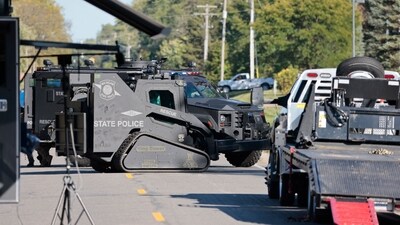 State police bomb squad work outside of the residence of the alleged shooting suspect in Burton, Michigan after at least two people were killed and several others were injured Sunday when a shooter targeted a church. (Jeff Kowalsky/AFP) State police bomb squad work outside of the residence of the alleged shooting suspect in Burton, Michigan after at least two people were killed and several others were injured Sunday when a shooter targeted a church. (Jeff Kowalsky/AFP)