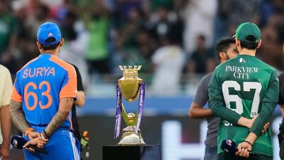 Suryakumar Yadav and Pakistan's captain Salman Agha ahead of the coin toss of the Asia Cup cricket final between India and Pakistan at Dubai International Cricket Stadium on Sunday. (AP) Suryakumar Yadav and Pakistan's captain Salman Agha ahead of the coin toss of the Asia Cup cricket final between India and Pakistan at Dubai International Cricket Stadium on Sunday. (AP)