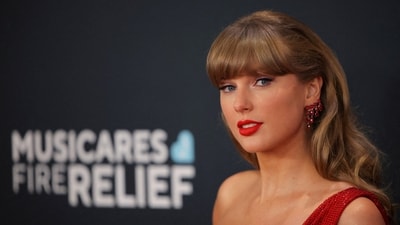 Taylor Swift poses at the red carpet during the 67th Annual Grammy Awards in Los Angeles (REUTERS)