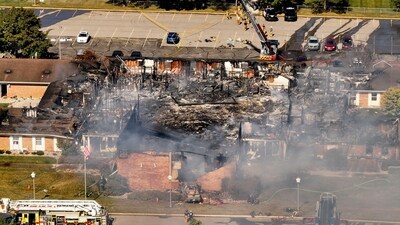 The debris of the Church of Jesus Christ of Latter-day Saints in Michigan are visible as dark smoke rises after the attack on Sunday. (David Guralnick/AP) The debris of the Church of Jesus Christ of Latter-day Saints in Michigan are visible as dark smoke rises after the attack on Sunday. (David Guralnick/AP)