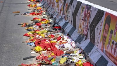 Footwear and other belongings of people lie on a road in the aftermath of stampede during a rally of actor and Tamilaga Vetri Kazhagam (TVK) chief Vijay, in Karur district, Tamil Nadu (PTI) Footwear and other belongings of people lie on a road in the aftermath of stampede during a rally of actor and Tamilaga Vetri Kazhagam (TVK) chief Vijay, in Karur district, Tamil Nadu (PTI)